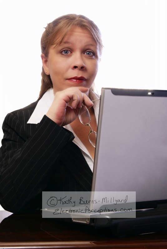 Stock Photo: Professional Woman Raises Eyebrows - by Kathy Burns-Millyard