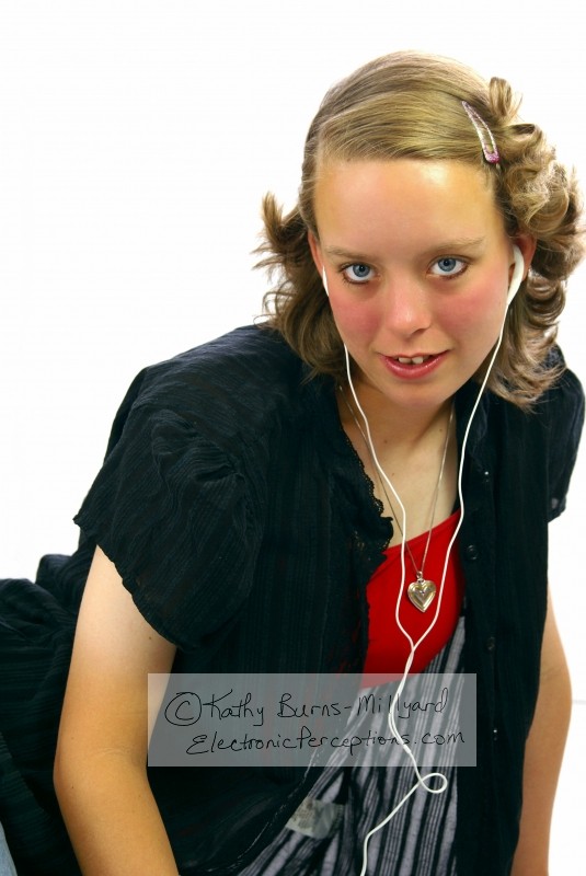Stock Photo: Beautiful Teen Girl Listening to Music - by Kathy Burns-Millyard
