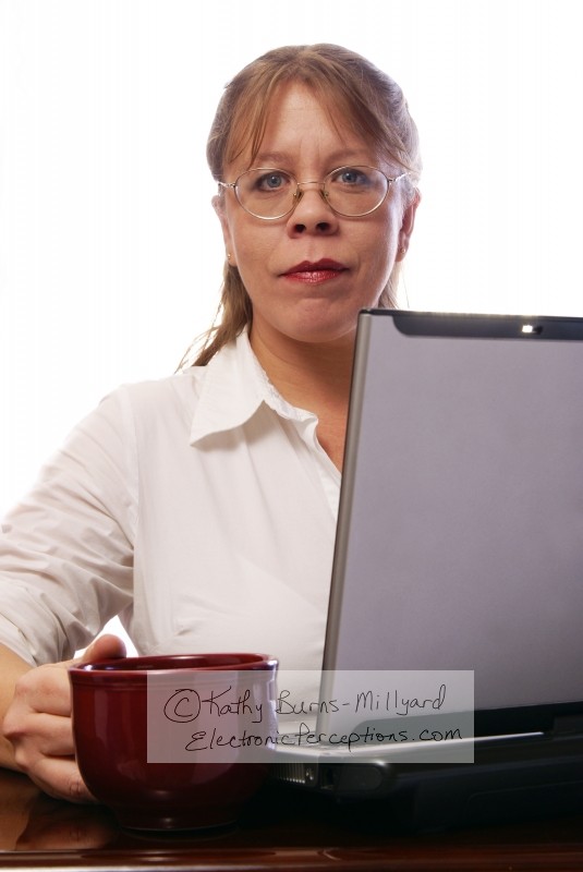 Stock Photo: Woman with Convertible Notebook - by Kathy Burns-Millyard