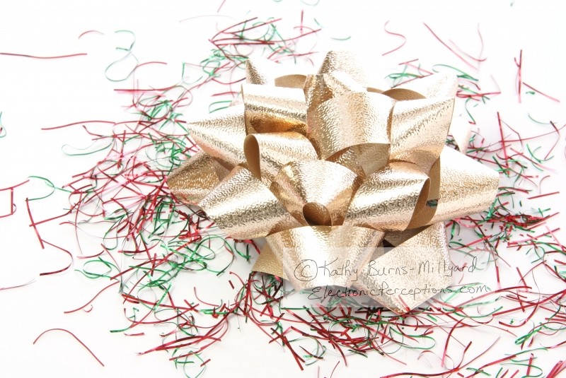 Stock Photo: Gold Gift Bow - by Kathy Burns-Millyard