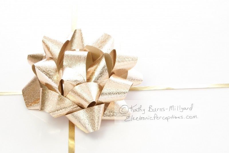 Stock Photo: Gold Bow Package - by Kathy Burns-Millyard
