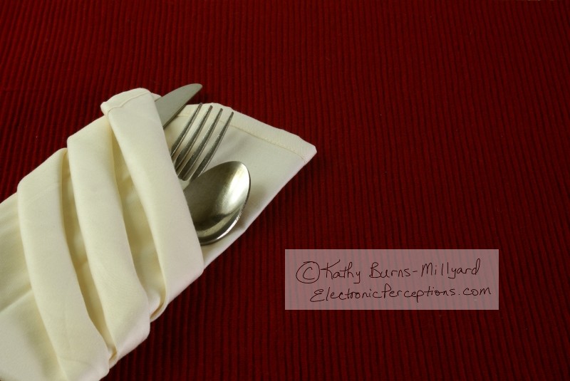 Stock Photo: Silverware in Napkin - by Kathy Burns-Millyard