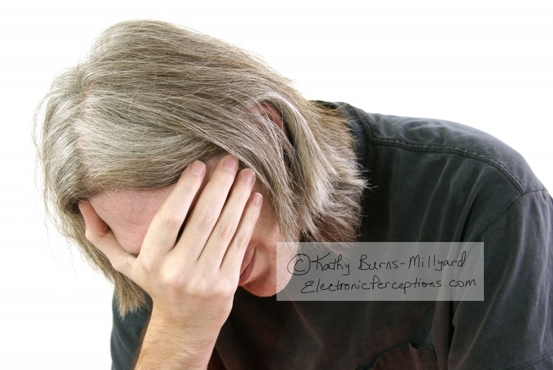 Stock Photo: Man With Face In Hand - by Kathy Burns-Millyard