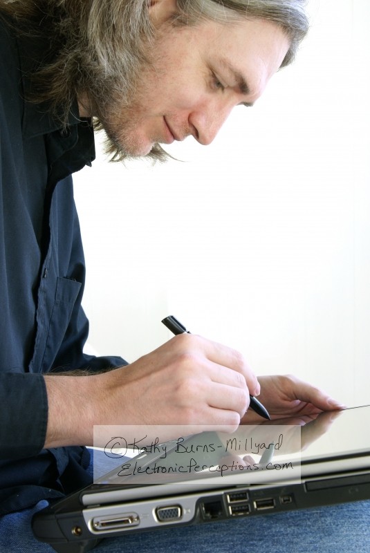 Stock Photo: Man Writing on Tablet PC - by Kathy Burns-Millyard